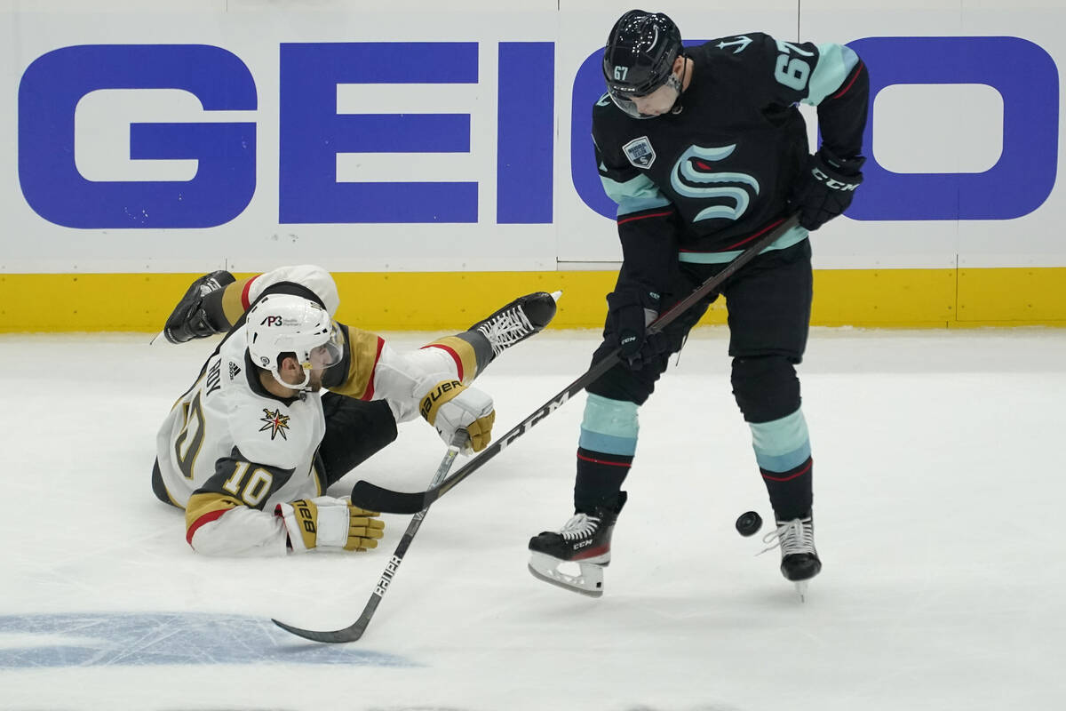 Seattle Kraken center Morgan Geekie (67) takes control of the puck as Vegas Golden Knights cent ...