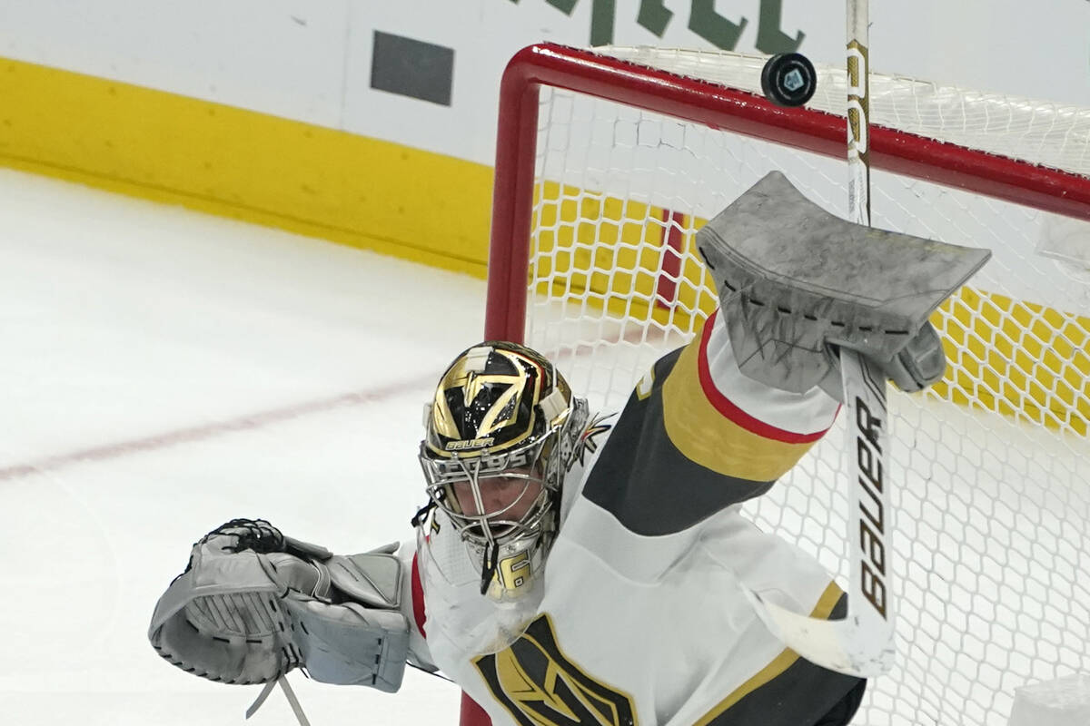 Vegas Golden Knights goaltender Logan Thompson (36) deflects a shot during the third period of ...