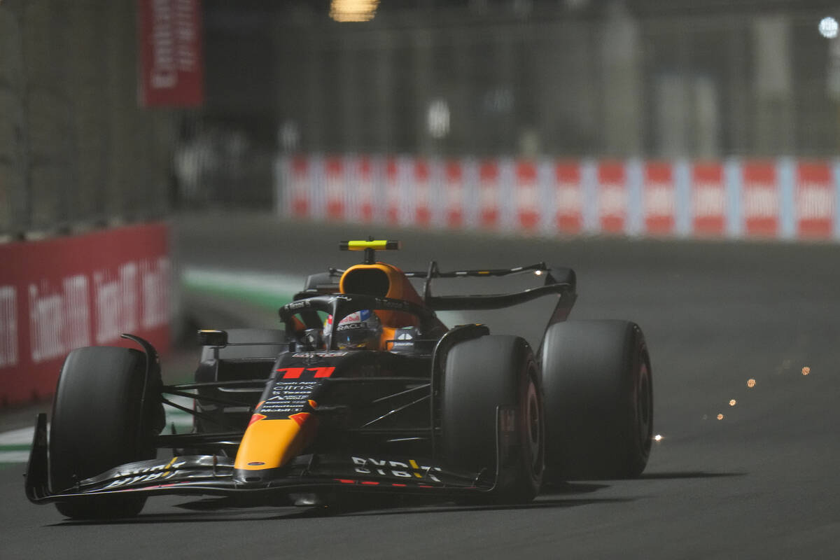 Red Bull driver Sergio Perez of Mexico steers his car during qualifying session for the Formula ...