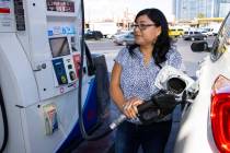 Rosa Aguirre of California pumps gas at ARCO gas station on Tropicana Avenue on Tuesday, March ...