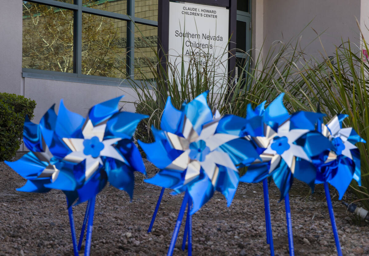 Pinwheels are planted outside the Southern Nevada Children’s Advocacy Center within the ...