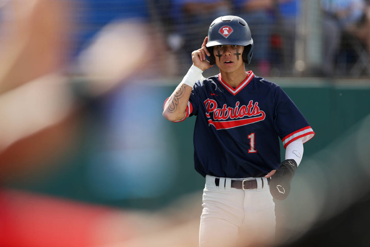 Liberty’s Logan Meusy (1) scores a run during a baseball game against Bishop Gorman at B ...