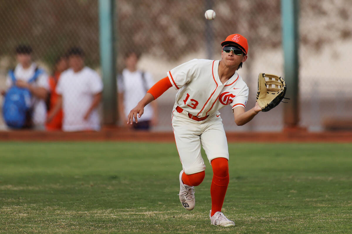 Bishop Gorman’s Aiden Pollock (13) makes an outfield catch for an out during a baseball ...