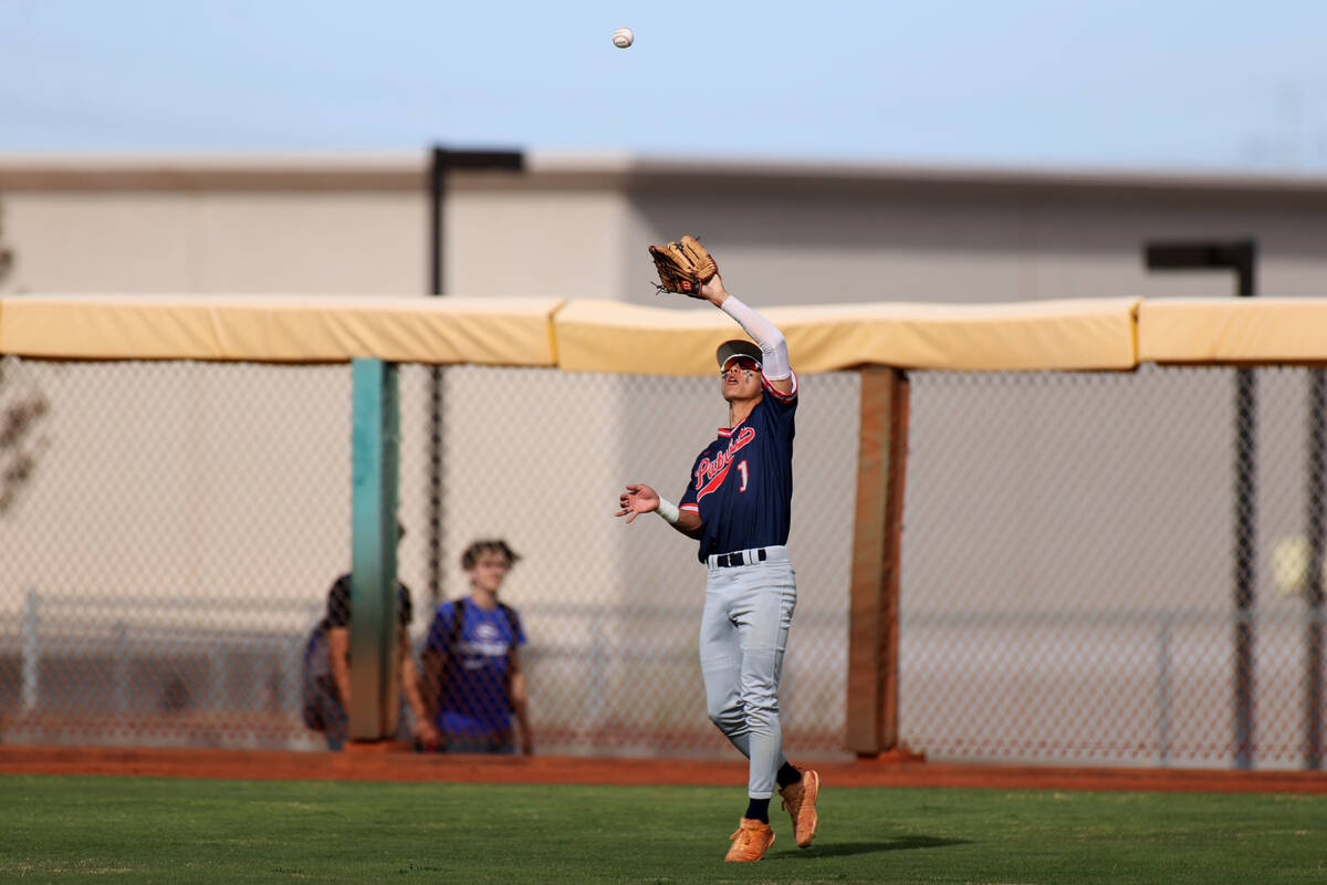 Liberty’s Logan Meusy (1) makes an outfield catch for an out during a baseball game agai ...