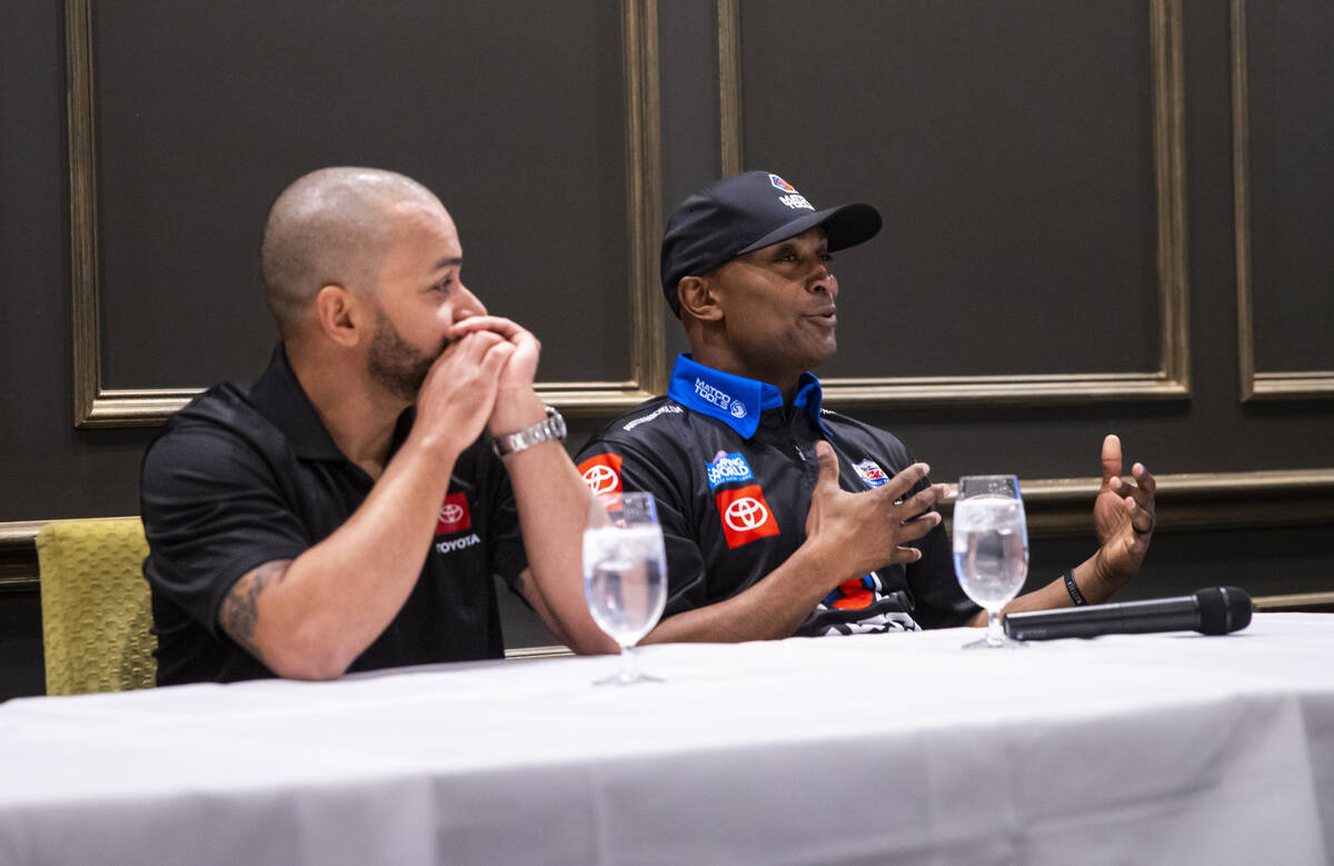 Toyota Top Fuel driver Antron Brown, right, speaks alongside J.R. Todd during a press conferenc ...