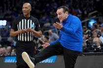 Duke head coach Mike Krzyzewski, right, reacts during the first half of his team's college bask ...