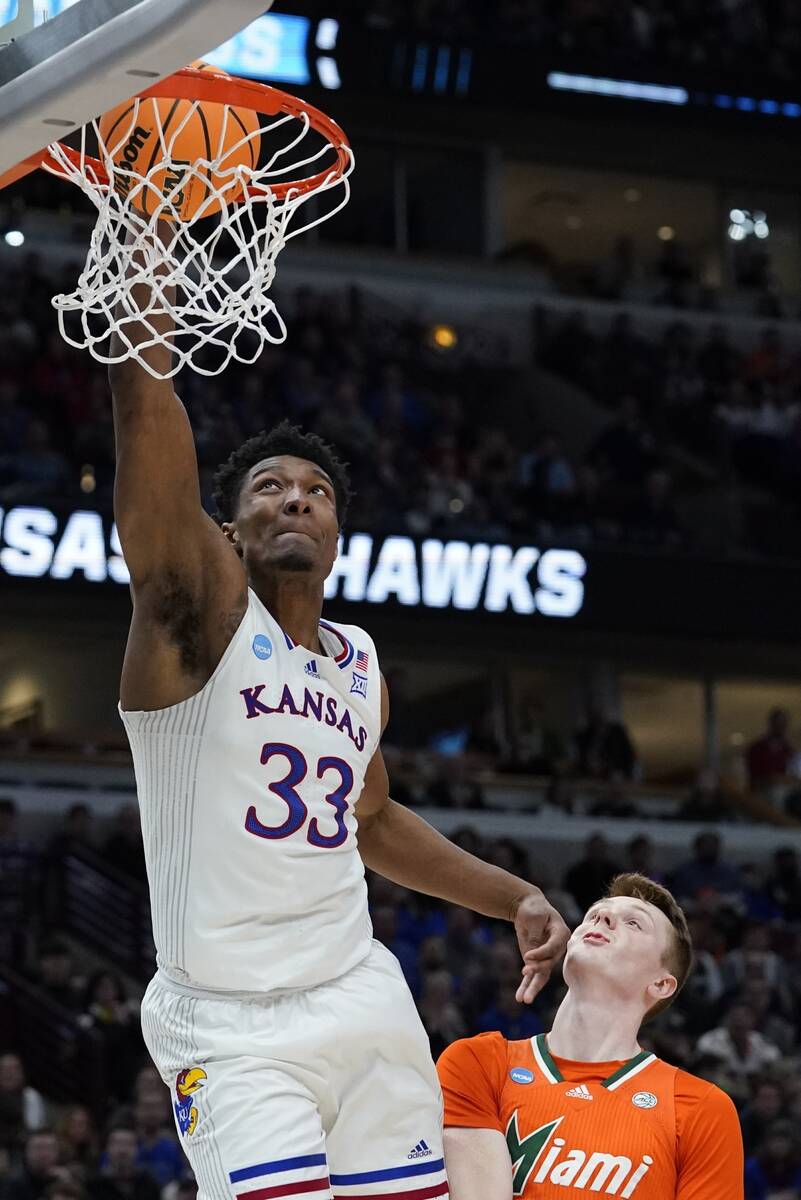 Kansas' David McCormack dunks during the second half of a college basketball game in the Elite ...