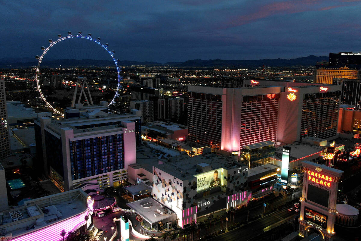 Aerial view of the Linq and Flamingo hotel casinos on the central Las Vegas Strip at sunset in ...