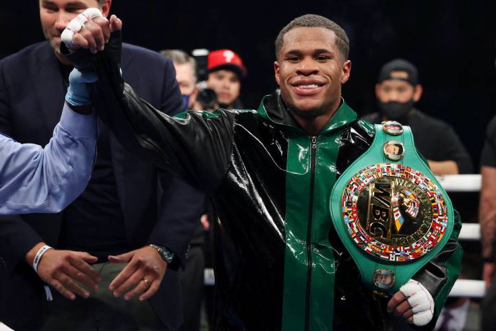 Devin Haney has his hand raises by referee Russell Mora after his win by unanimous decision aga ...