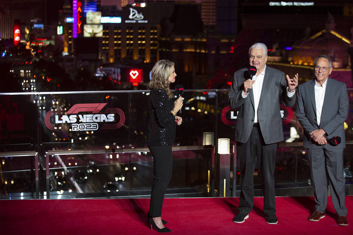 Gov. Steve Sisolak, center, and Clark County Commissioner Jim Gibson, right, announce a Formula ...
