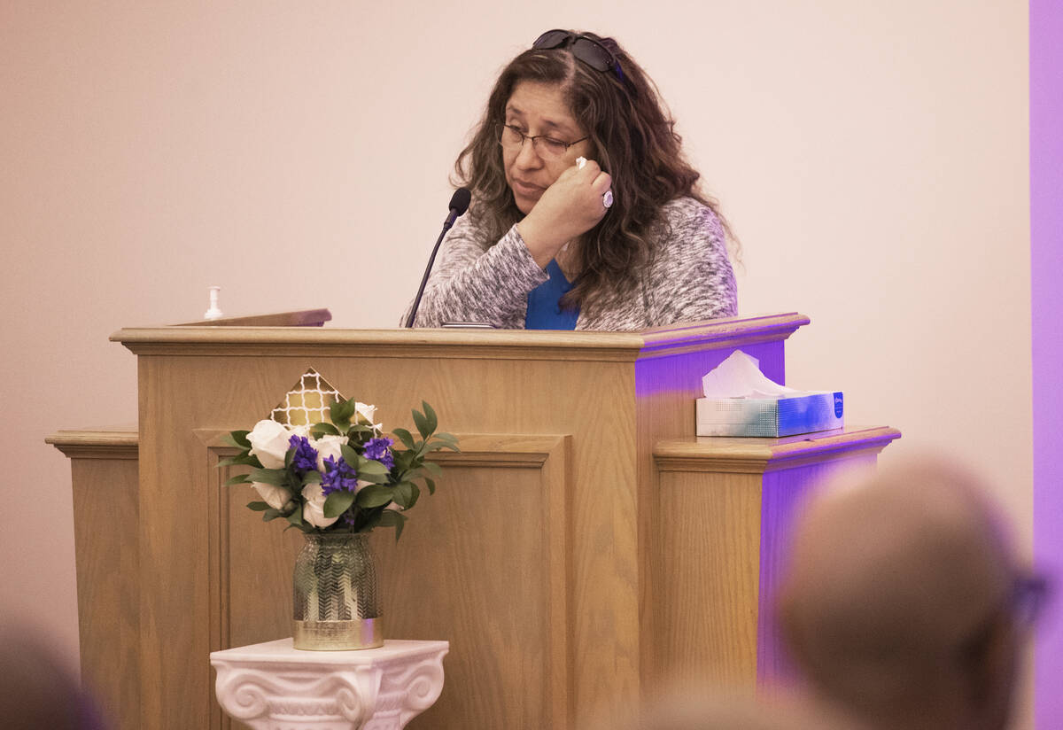 Alicia Jimenez, life partner of Elwood Hensey, wipes away tears while speaking at Hensey’s fu ...