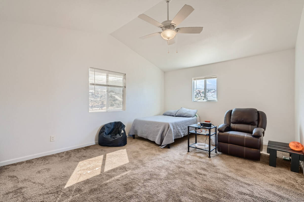 The primary bedroom inside a house at 73 Pinon Road, Cold Creek, Nevada. It's a home for sale a ...