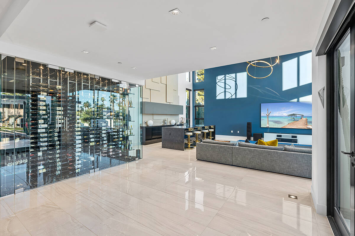 The wine wall is off the living room. (Napoli Group)