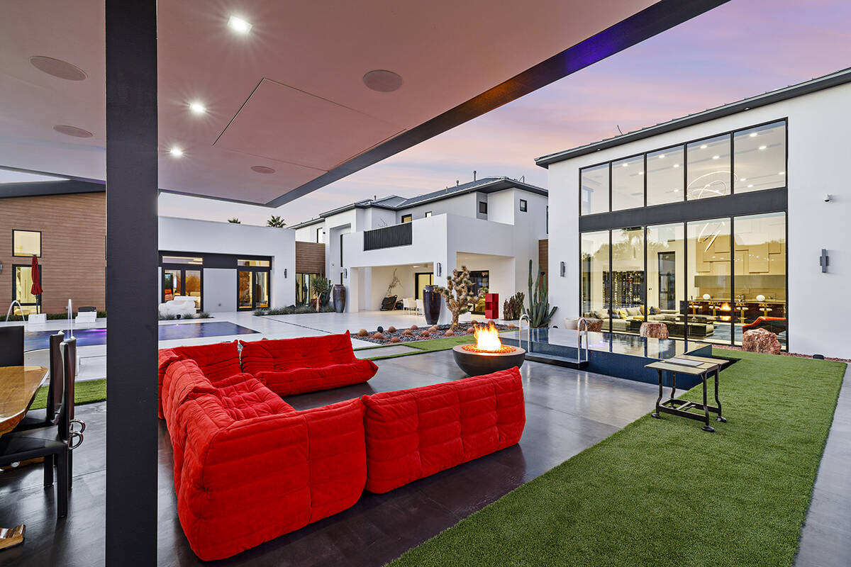 Outdoor seating area with fire pit. (Napoli Group)