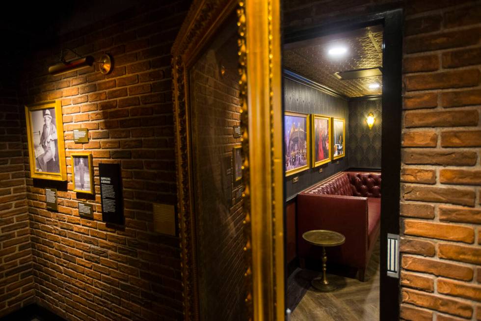 A room hidden by a full-length portrait in the speakeasy features 1920s artwork at The Undergro...