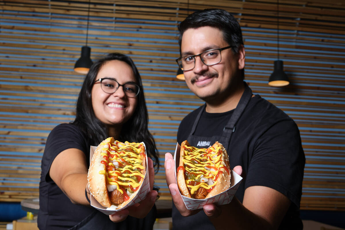 Phyto's Vegan Eats owners Monica and Anibal Flores display some of their vegan hot dogs. They w ...