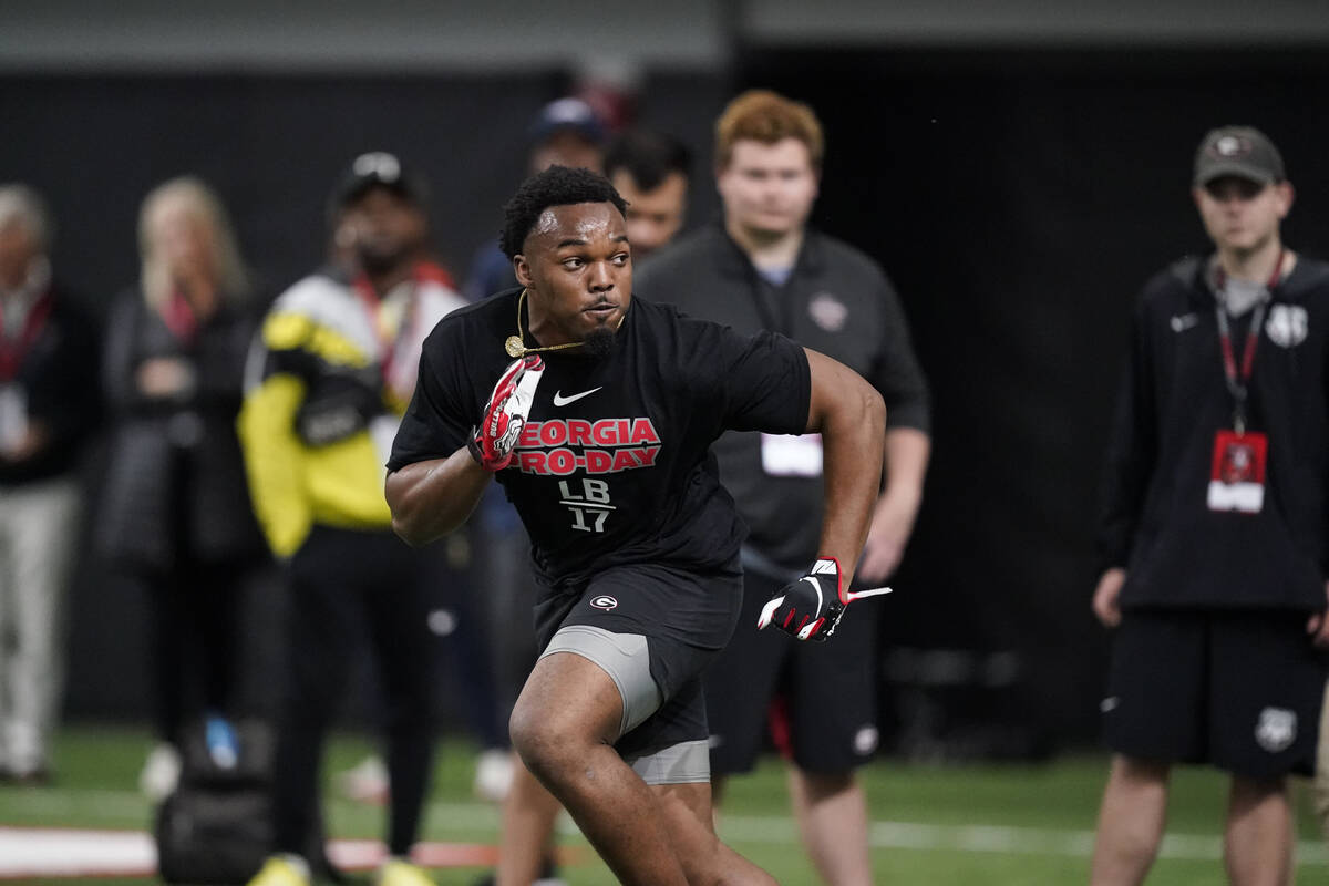 Nakobe Dean runs football drills during Georgia's Pro Day on Wednesday, March 16, 2022, in Athe ...