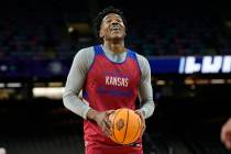 Kansas guard Ochai Agbaji smiles during practice for the men's Final Four NCAA college basketba ...