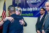 Nevada Donor Network Foundation President Steven Peralta, left, hugs Courtney Kaplan after she ...
