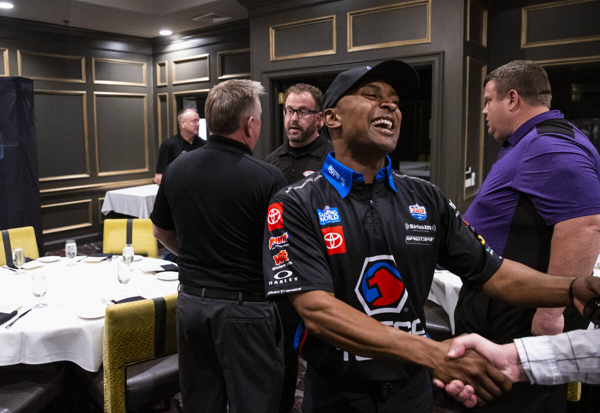 Toyota Top Fuel driver Antron Brown greets Review-Journal columnist Ron Kantowski before a pres ...
