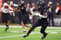 UNLV Rebels running back Charles Williams (8) runs the ball during the second half of an NCAA f ...