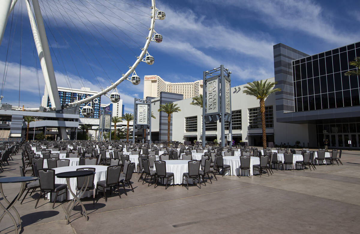 Chairs and tables are set at the Caesars Forum as the NFL Draft Theater, not pictured, is built ...