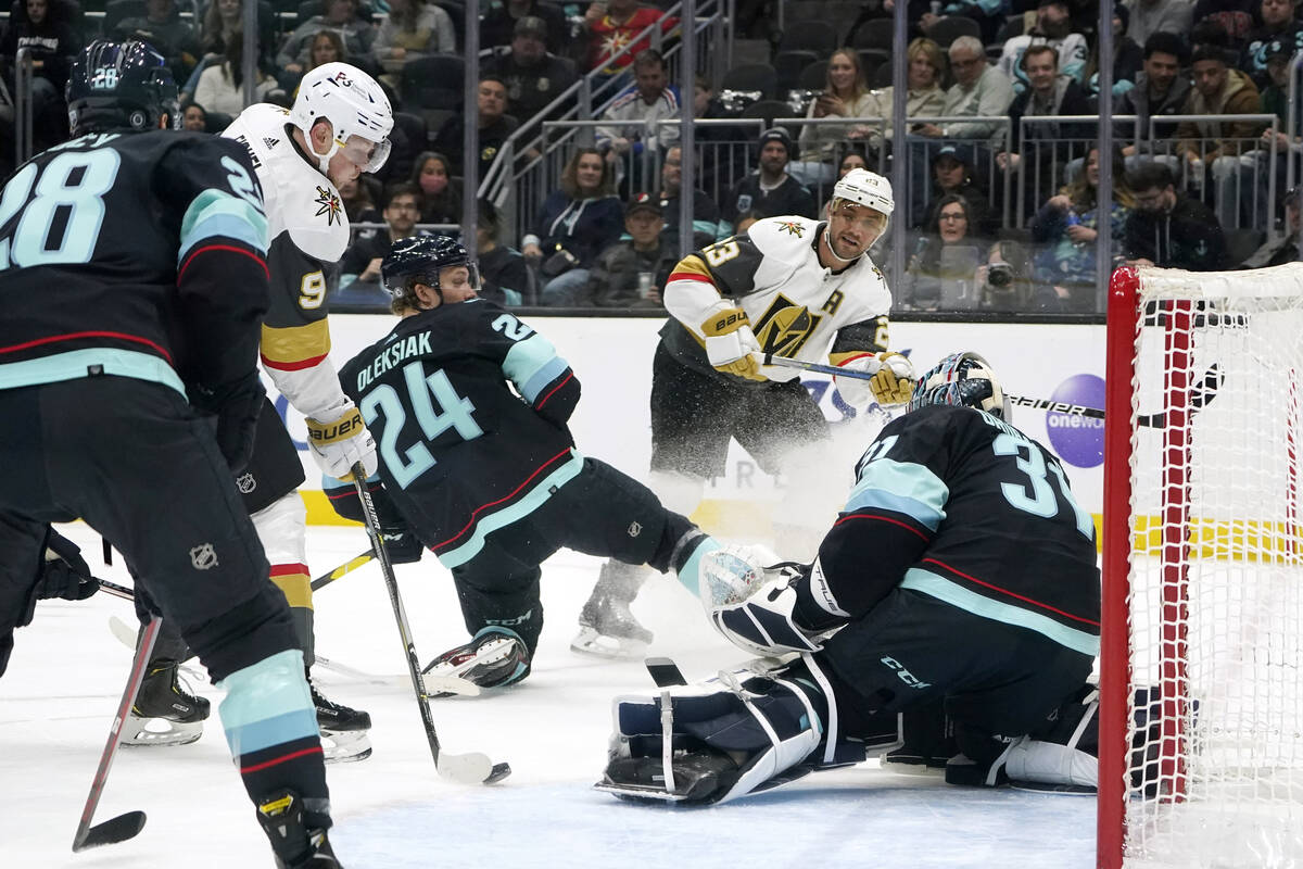 Vegas Golden Knights' Jack Eichel (9) scores on Seattle Kraken goalie Philipp Grubauer during t ...