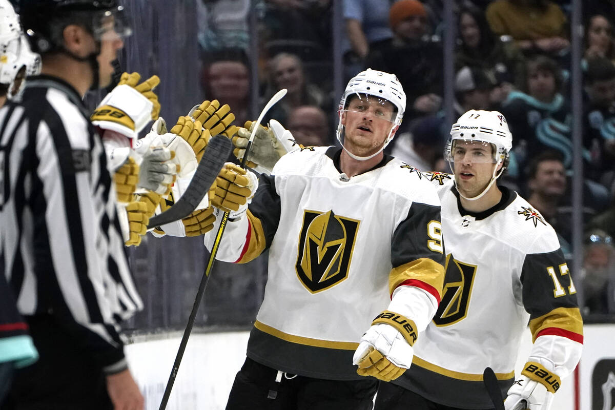 Vegas Golden Knights' Jack Eichel (9) is congratulated after scoring against the Seattle Kraken ...