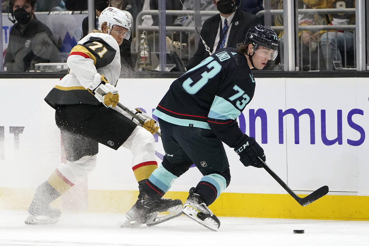 Seattle Kraken's Kole Lind (73) skates ahead of Vegas Golden Knights' William Karlsson during t ...