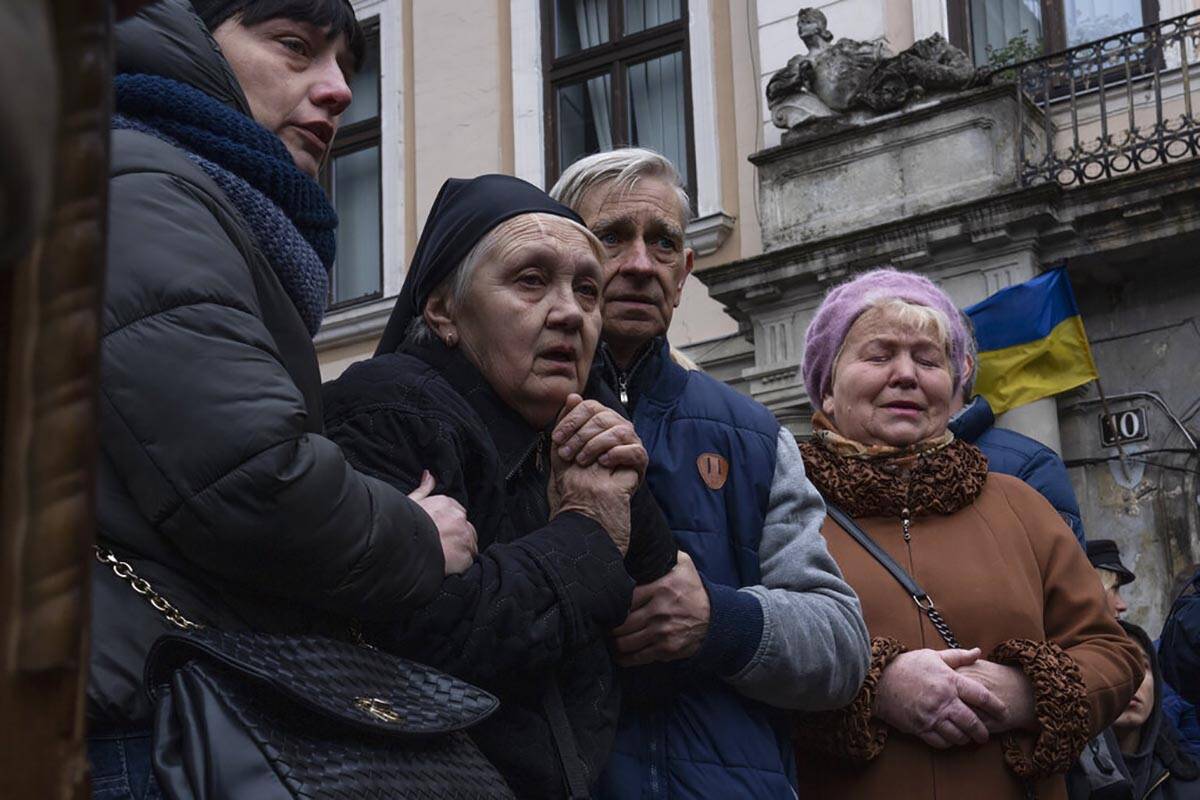 The mother of 40-year-old Senior lieutenant, Oliynyk Dmytro, mourns his death during his funera ...