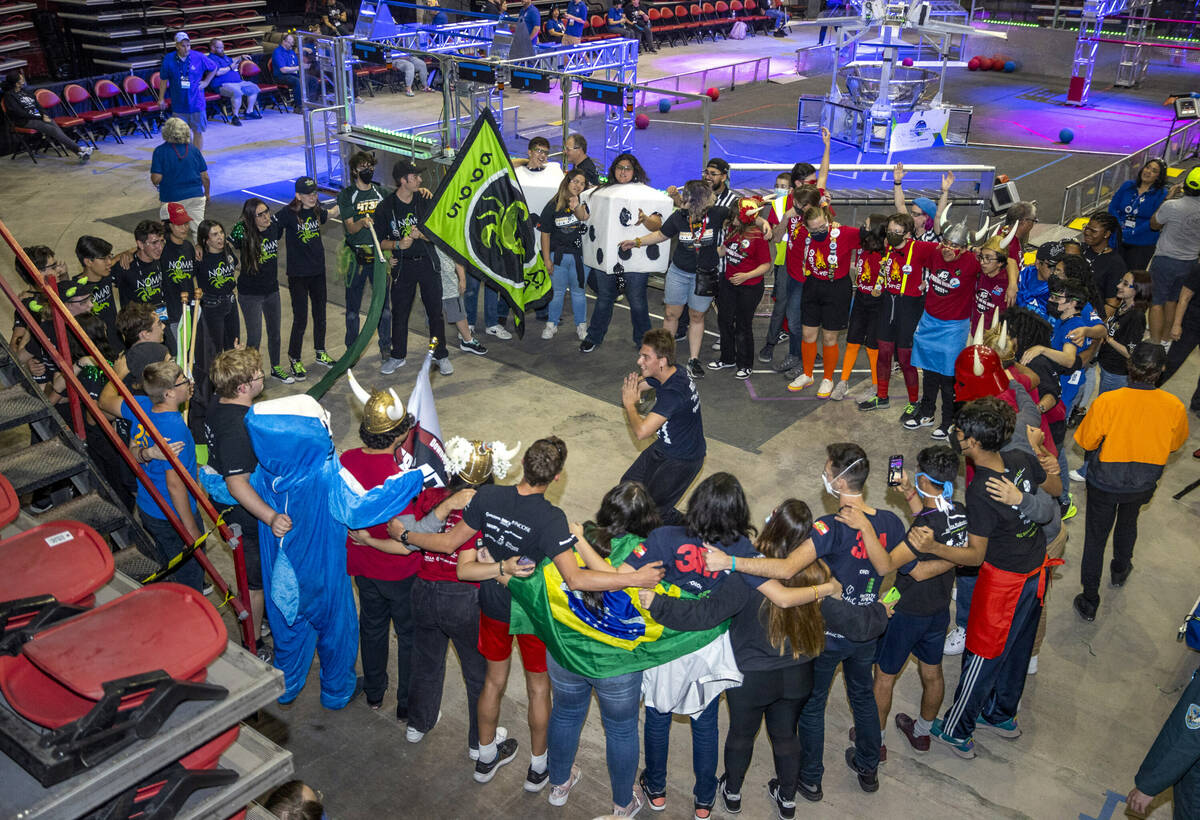 Teammates come together to dance and sing during ba temporary computer shutdown at the FIRST Ro ...