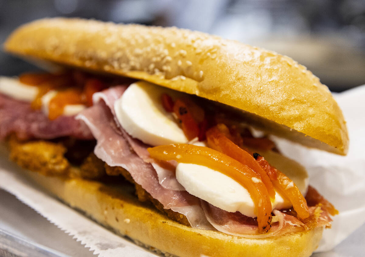 The Godfather hero sandwich made with chicken cutlet, prosciutto, fresh mozzarella, roasted red ...