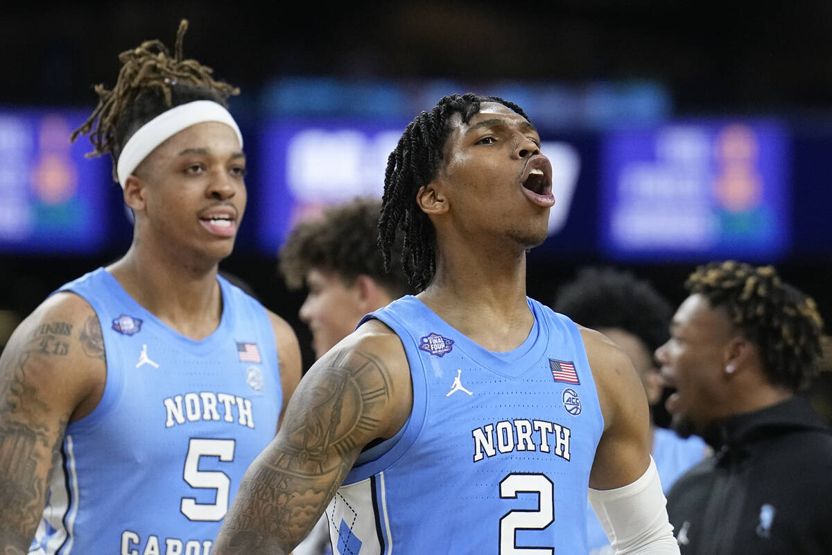 North Carolina's Caleb Love (2) celebrates after North Carolina's win against Duke in a college ...