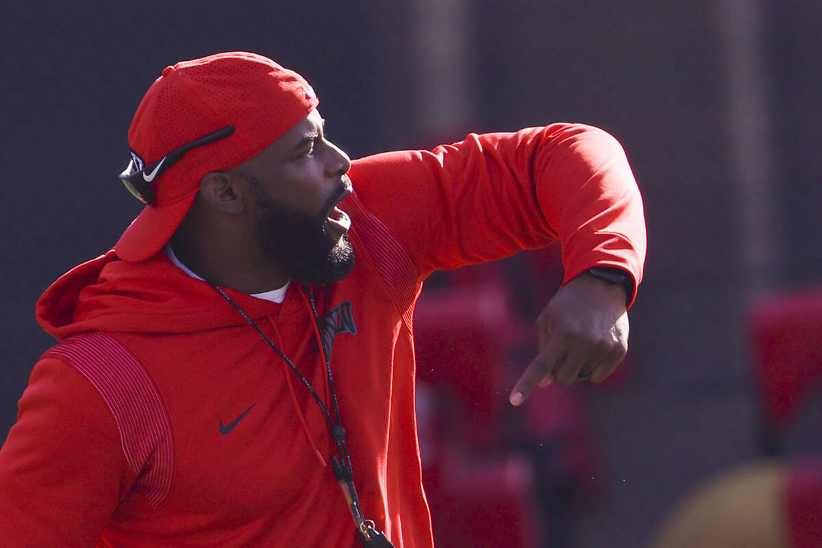 UNLV Rebels defensive coordinator Keith Heyward motions to his players during the first day of ...