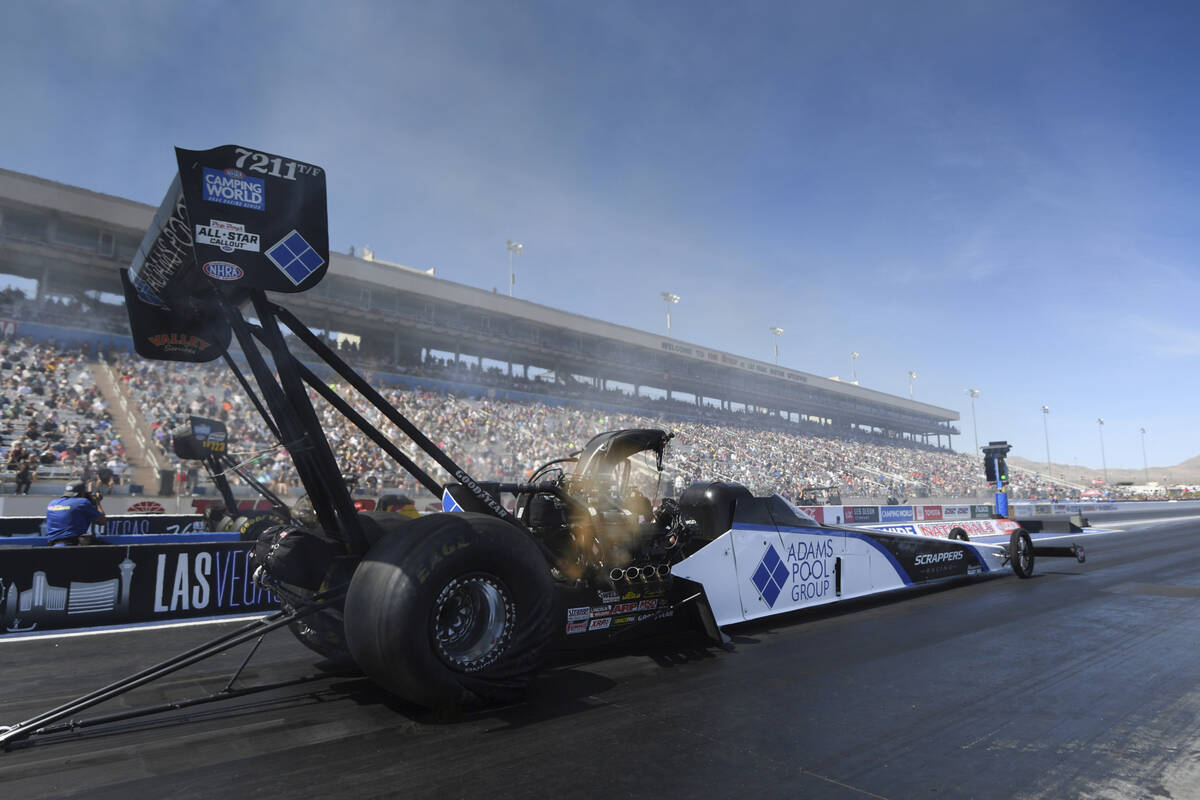 In this photo provided by the NHRA, Mike Salinas drives in Top Fuel qualifying Saturday, April ...