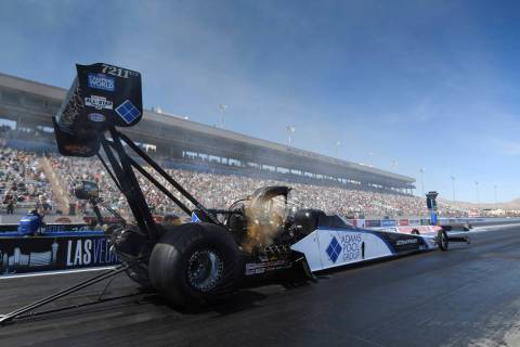 In this photo provided by the NHRA, Mike Salinas drives in Top Fuel qualifying Saturday, April ...
