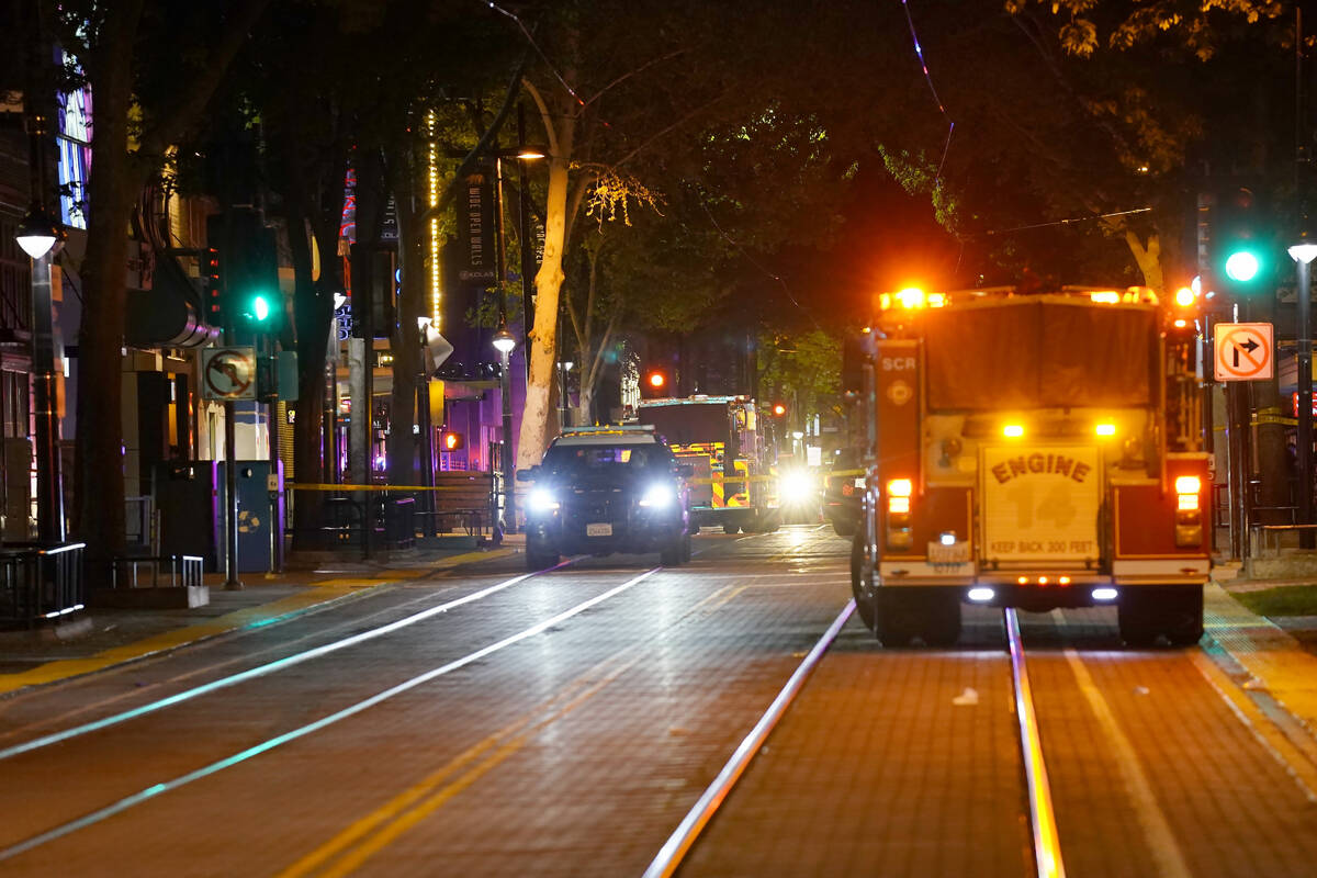 Emergency vehicles line the street near the scene of a mass shooting with multiple deaths in Sa ...