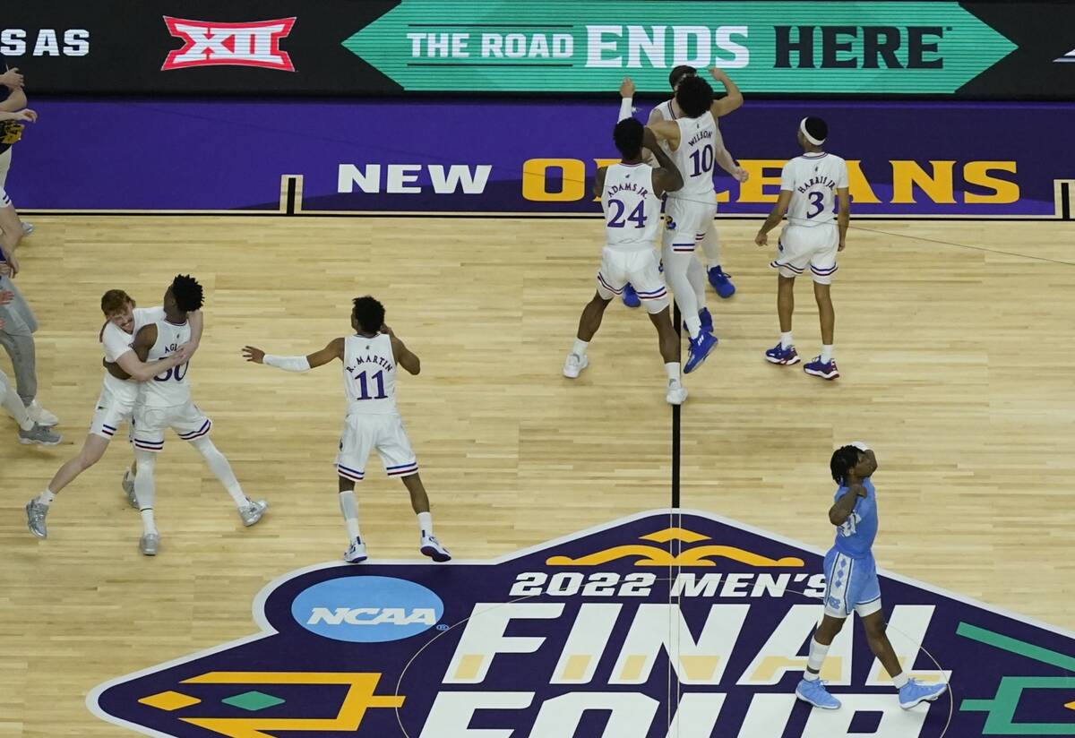 Kansas players celebrate after a college basketball game against North Carolina in the finals o ...