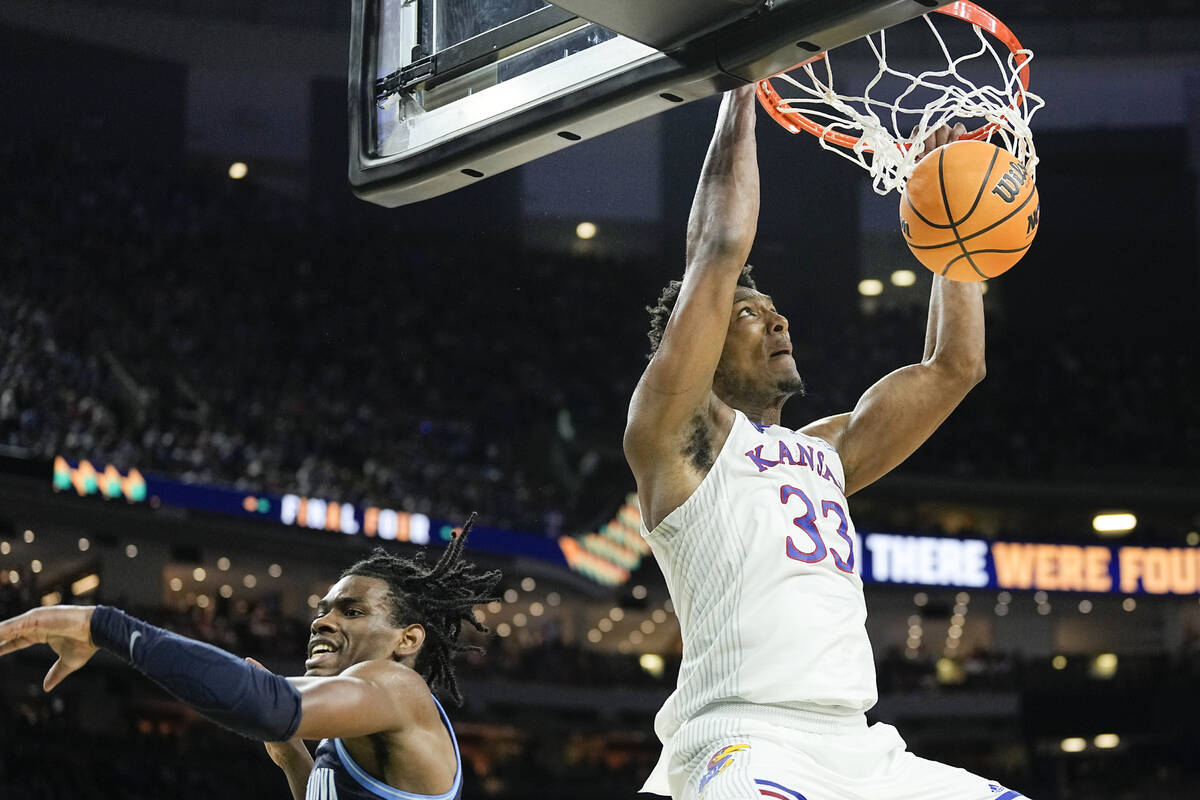 Kansas forward David McCormack (33) dunks over Villanova's Brandon Slater during the second hal ...