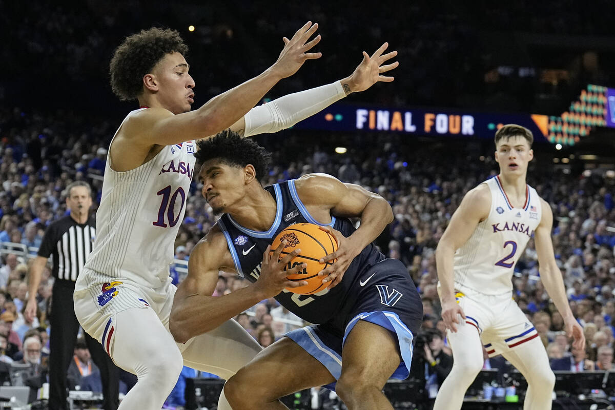 Villanova forward Jermaine Samuels drives against Kansas' Jalen Wilson (10) during the second h ...
