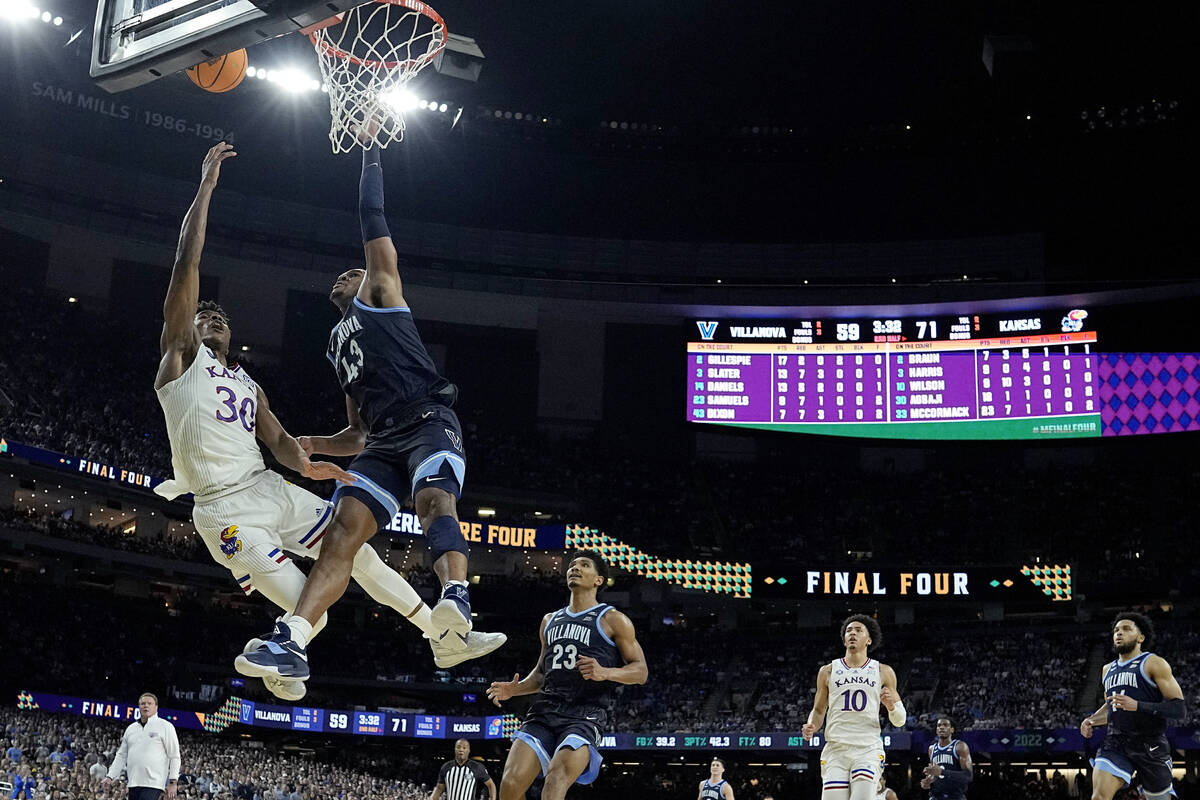 Kansas guard Ochai Agbaji (30) heads to the rim against Villanova forward Eric Dixon (43) durin ...