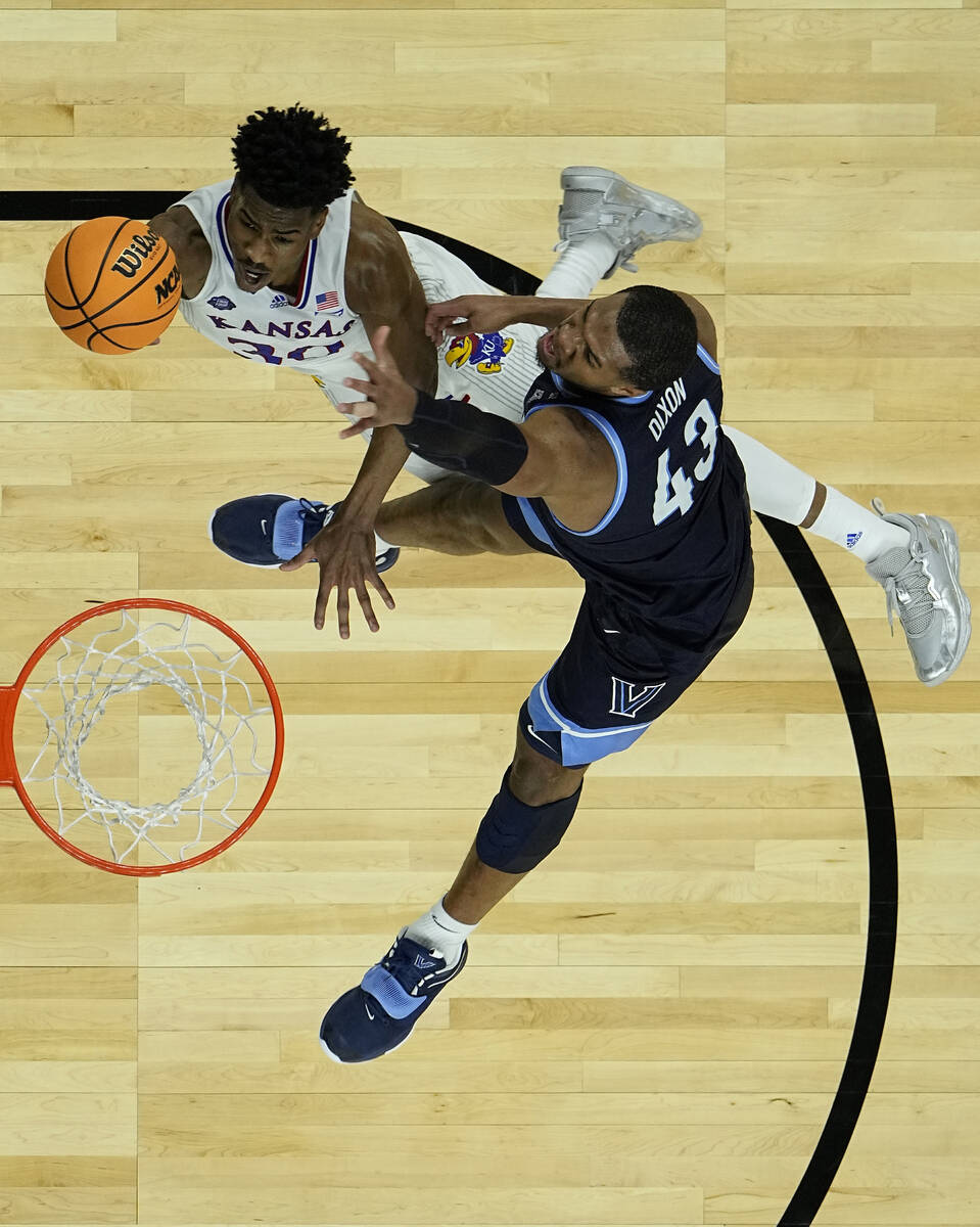 Kansas guard Ochai Agbaji (30) heads to the hoop against Villanova forward Eric Dixon (43) duri ...