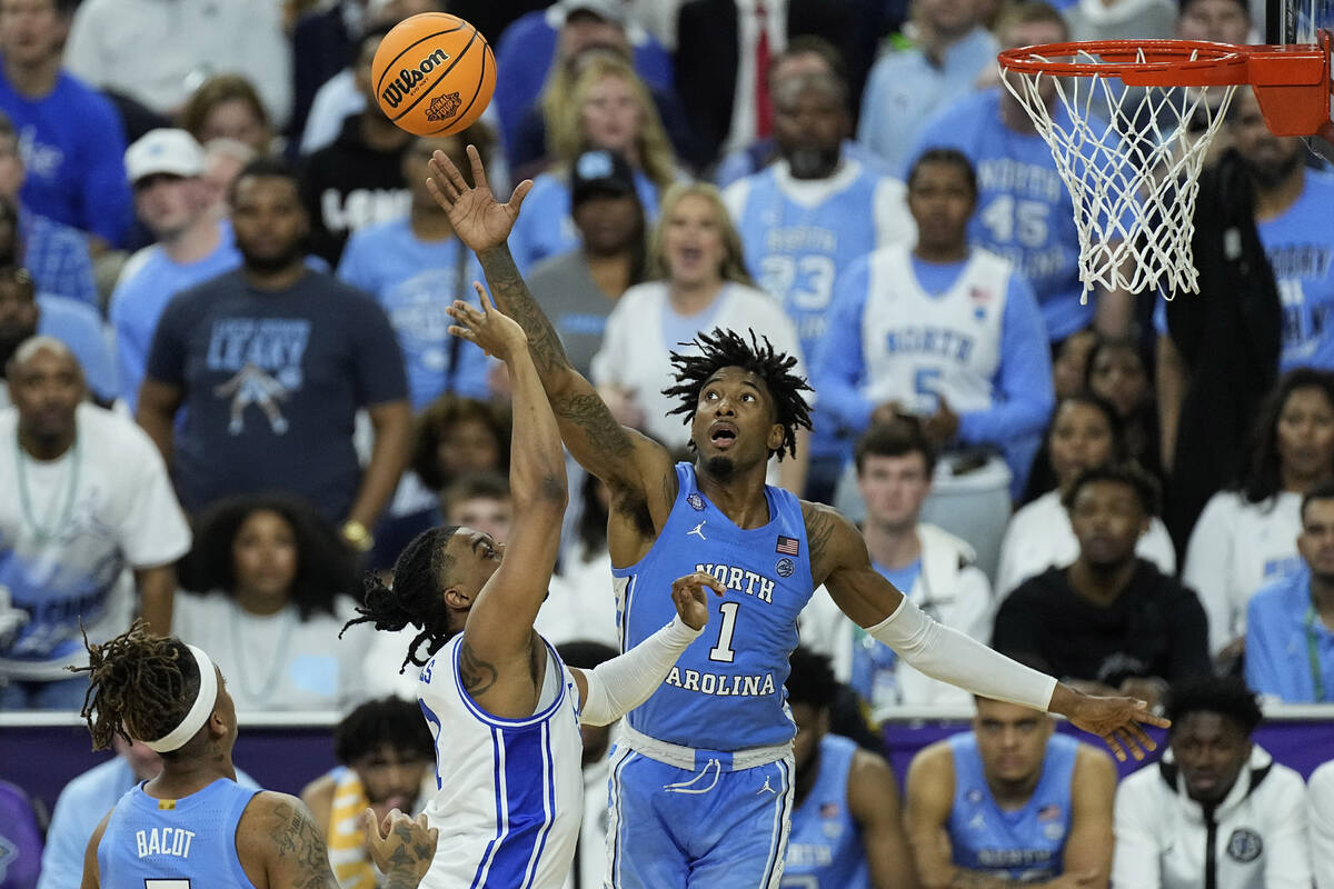Duke guard Trevor Keels shoots over North Carolina guard Leaky Black (1) during the first half ...