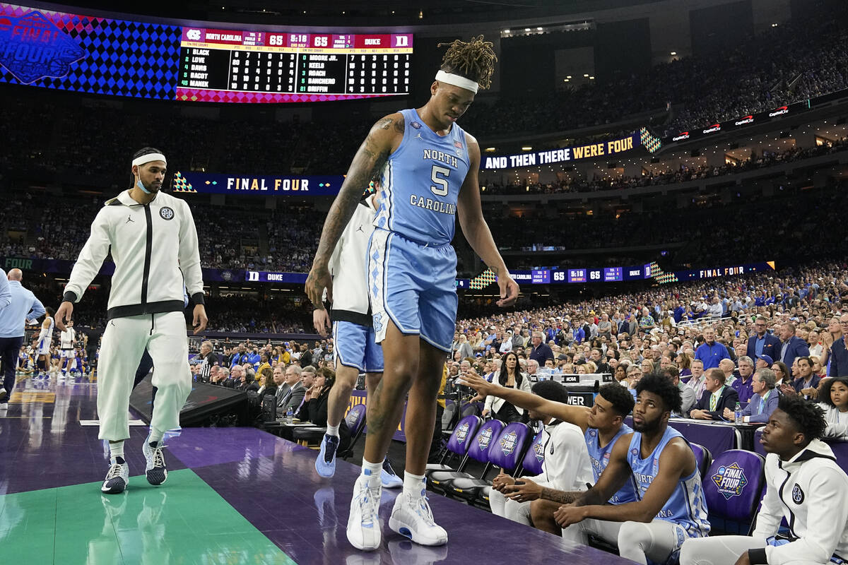 North Carolina forward Armando Bacot (5) leaves the court after being hurt during the second ha ...