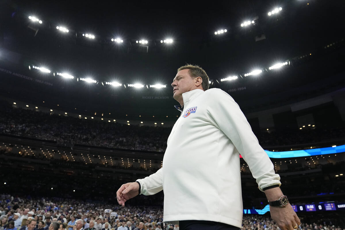 Kansas head coach Bill Self walks to the court for a college basketball game against Villanova ...