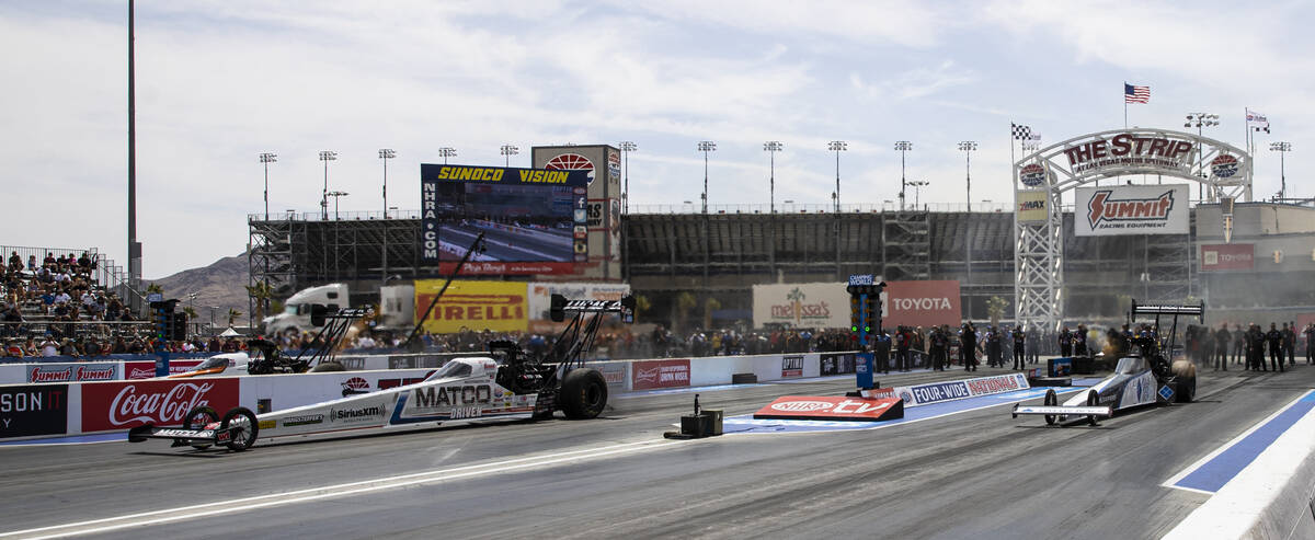 Top Fuel drivers Antron Brown, left, and Mike Salinas compete during the first round of Top Fue ...