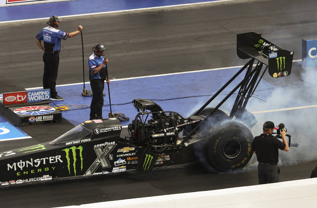Top Fuel driver Brittany Force does a burnout before the second round of Top Fuel eliminations ...