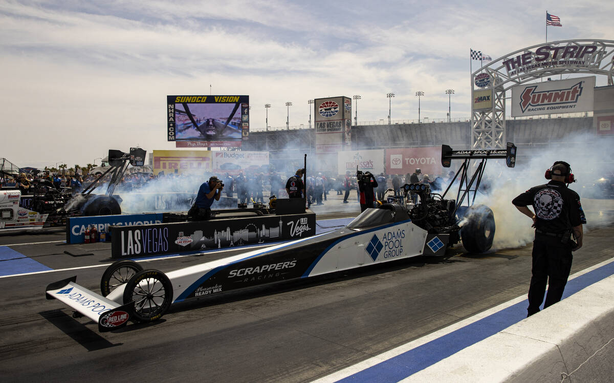 Top Fuel driver Mike Salinas does a burnout before the first round of Top Fuel eliminations at ...