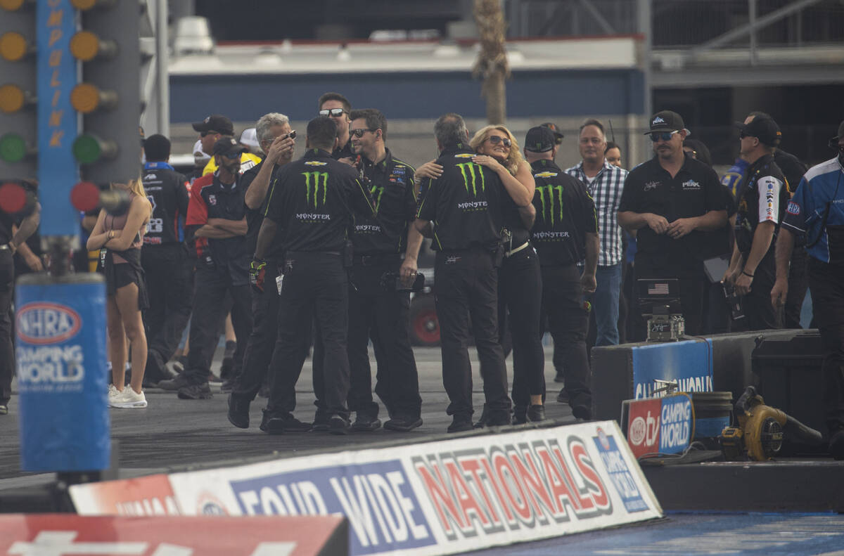 Crew members of Top Fuel driver Brittany Force celebrate her win in Top Fuel at the NHRA Four-W ...