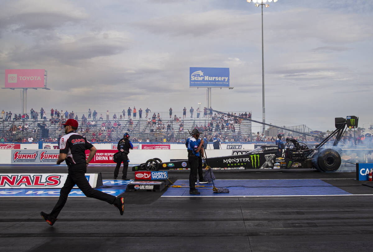Top Fuel driver Brittany Force does a burnout before competing to win in the finals of the Top ...